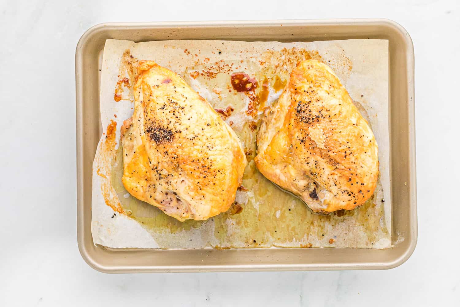 Two roasted bone in chicken breasts.