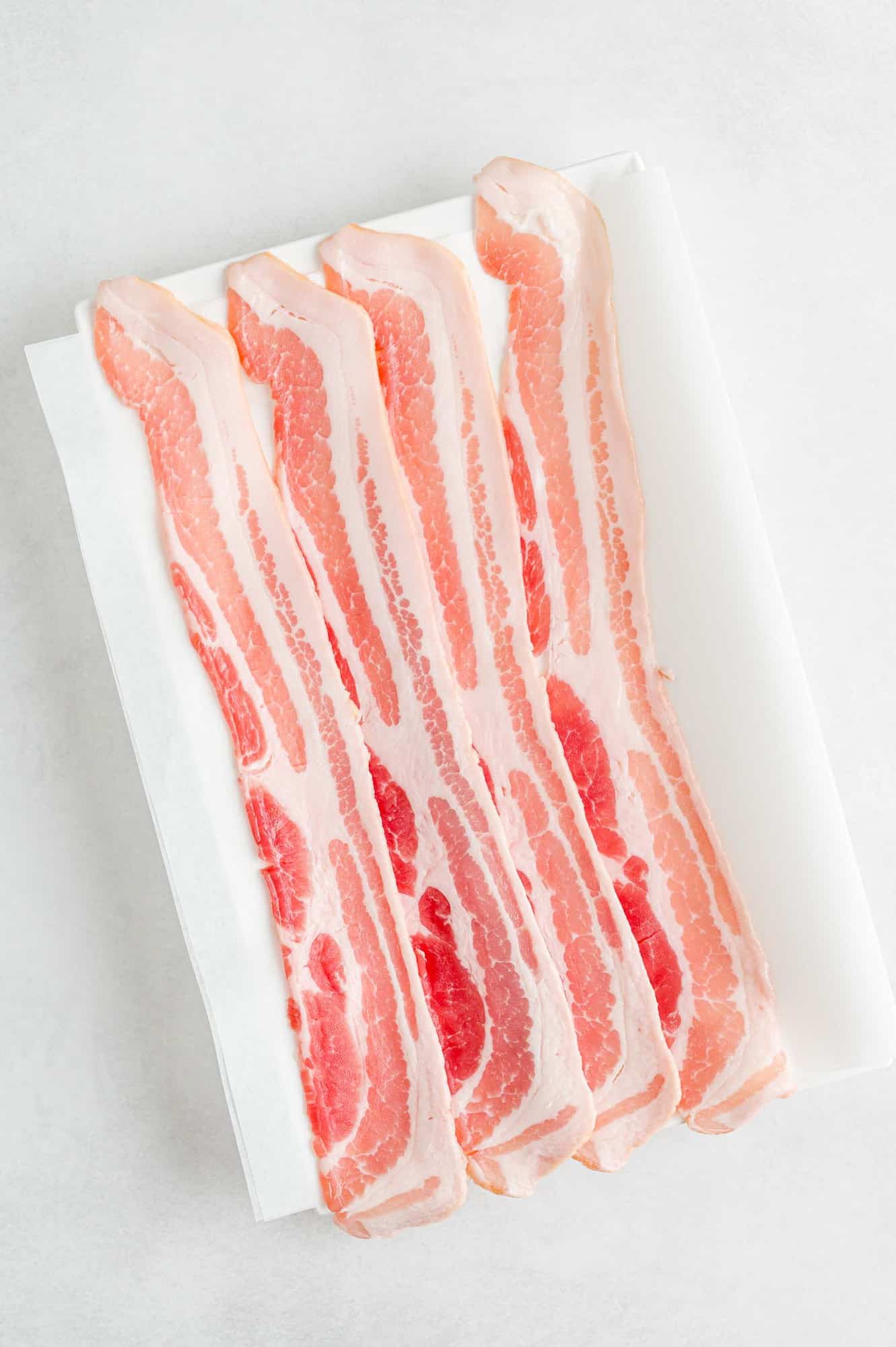 Uncooked bacon.