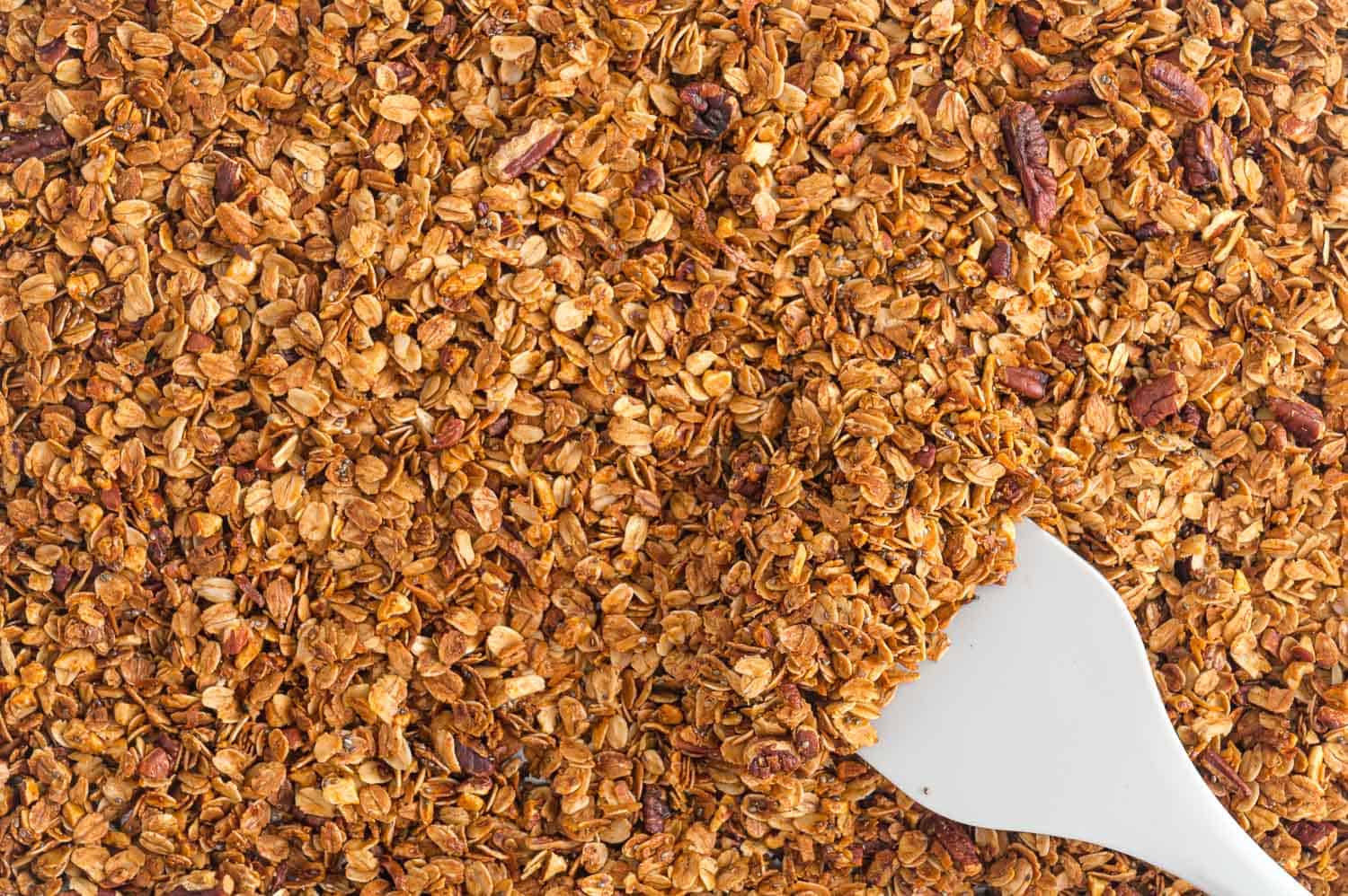 Browned granola on pan.