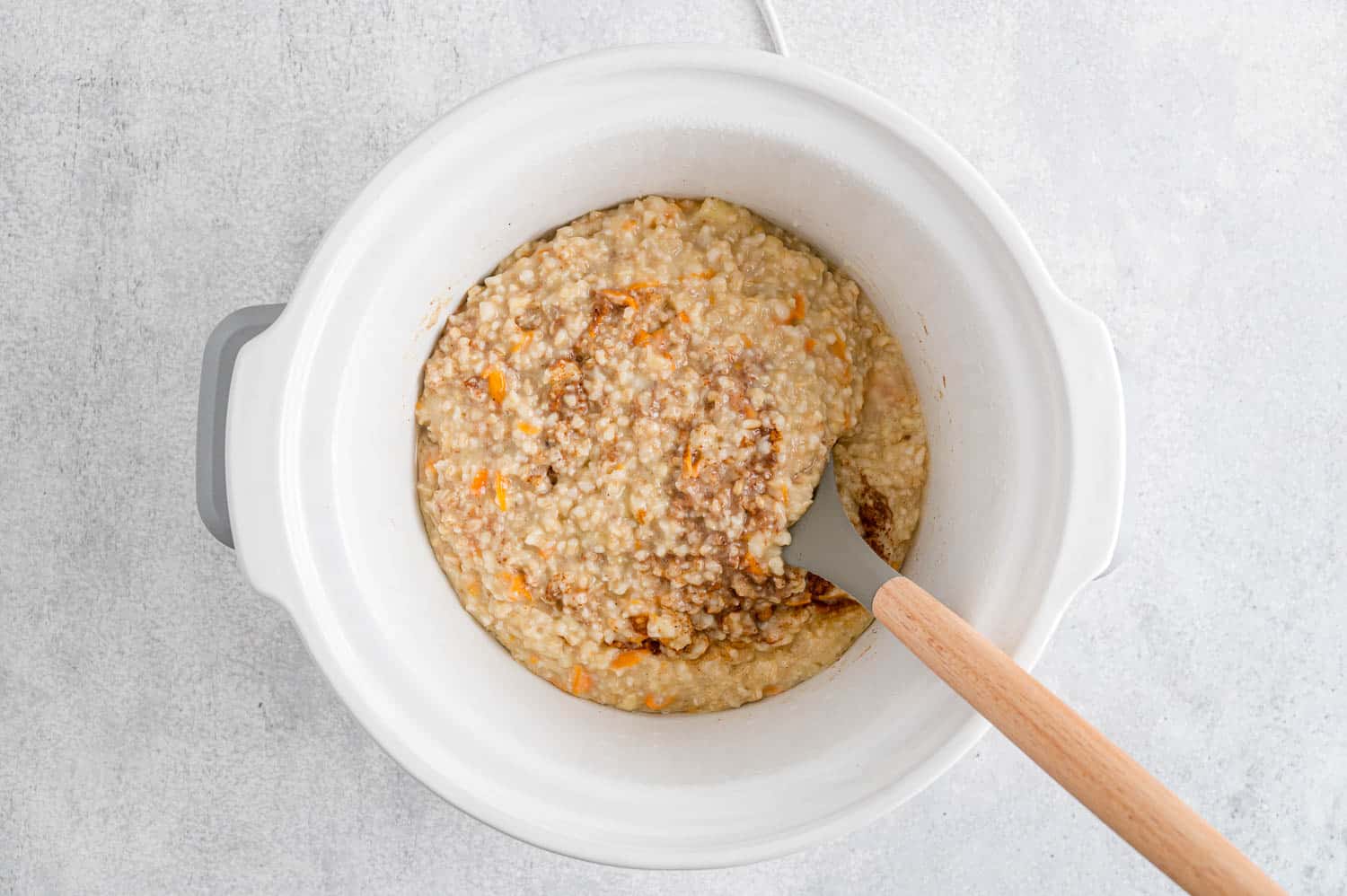 Oatmeal being stirred.