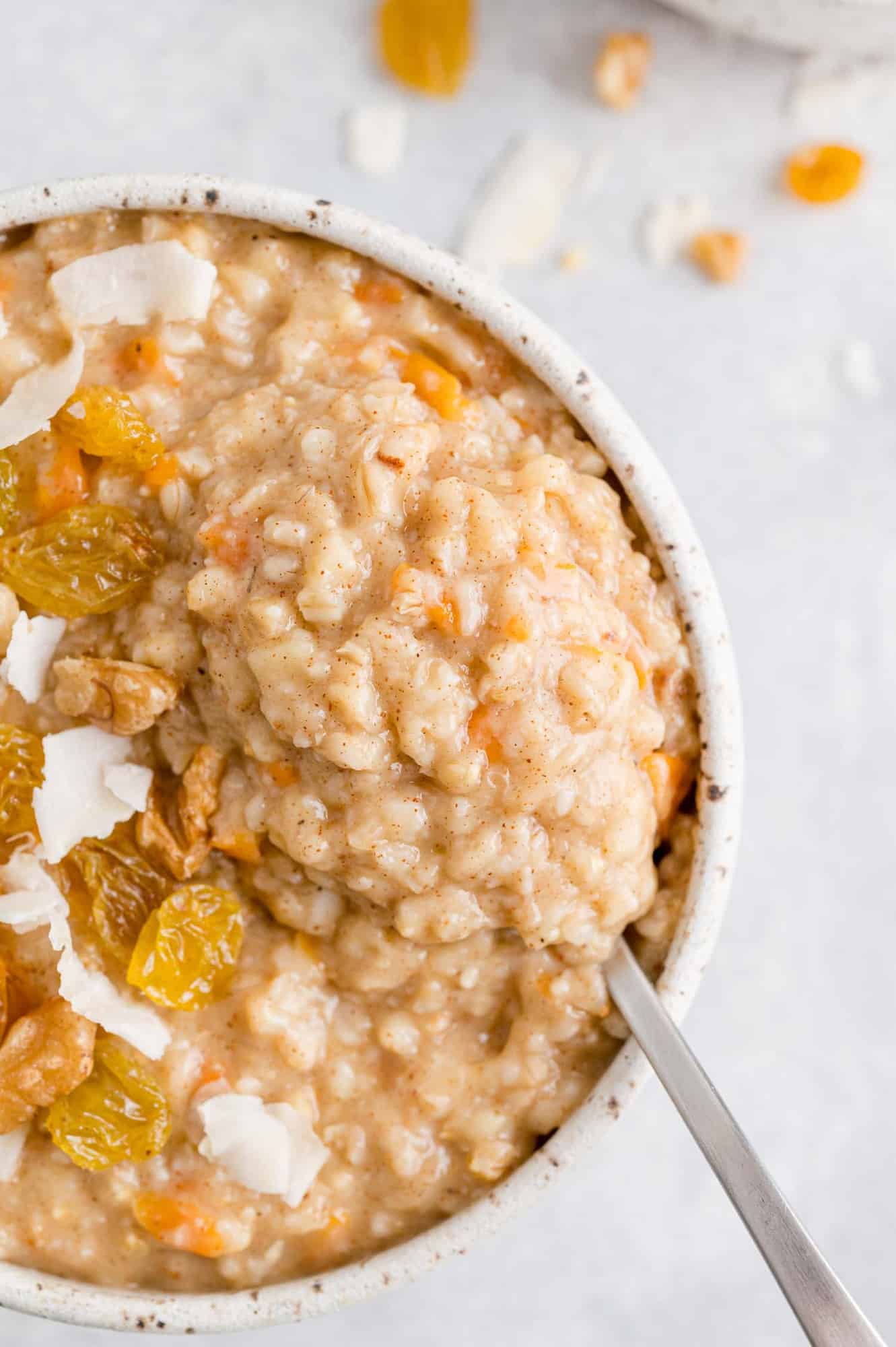 Oatmeal on a spoon to show ingredients and texture.