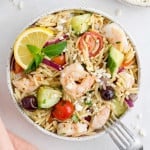 Greek orzo salad with shrimp, olives, tomatoes.