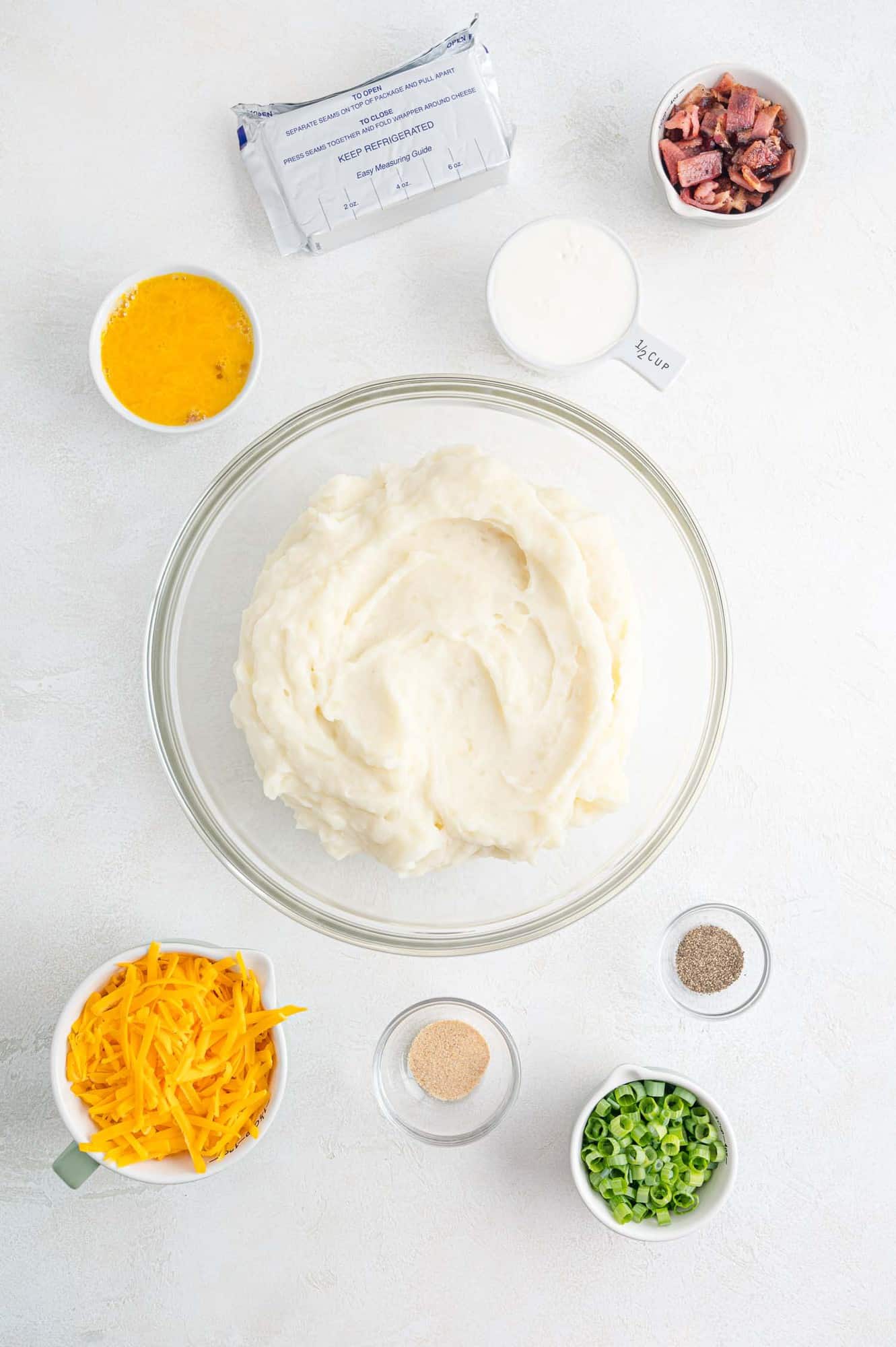 Ingredients needed inclduing mashed potatoes and cheese.