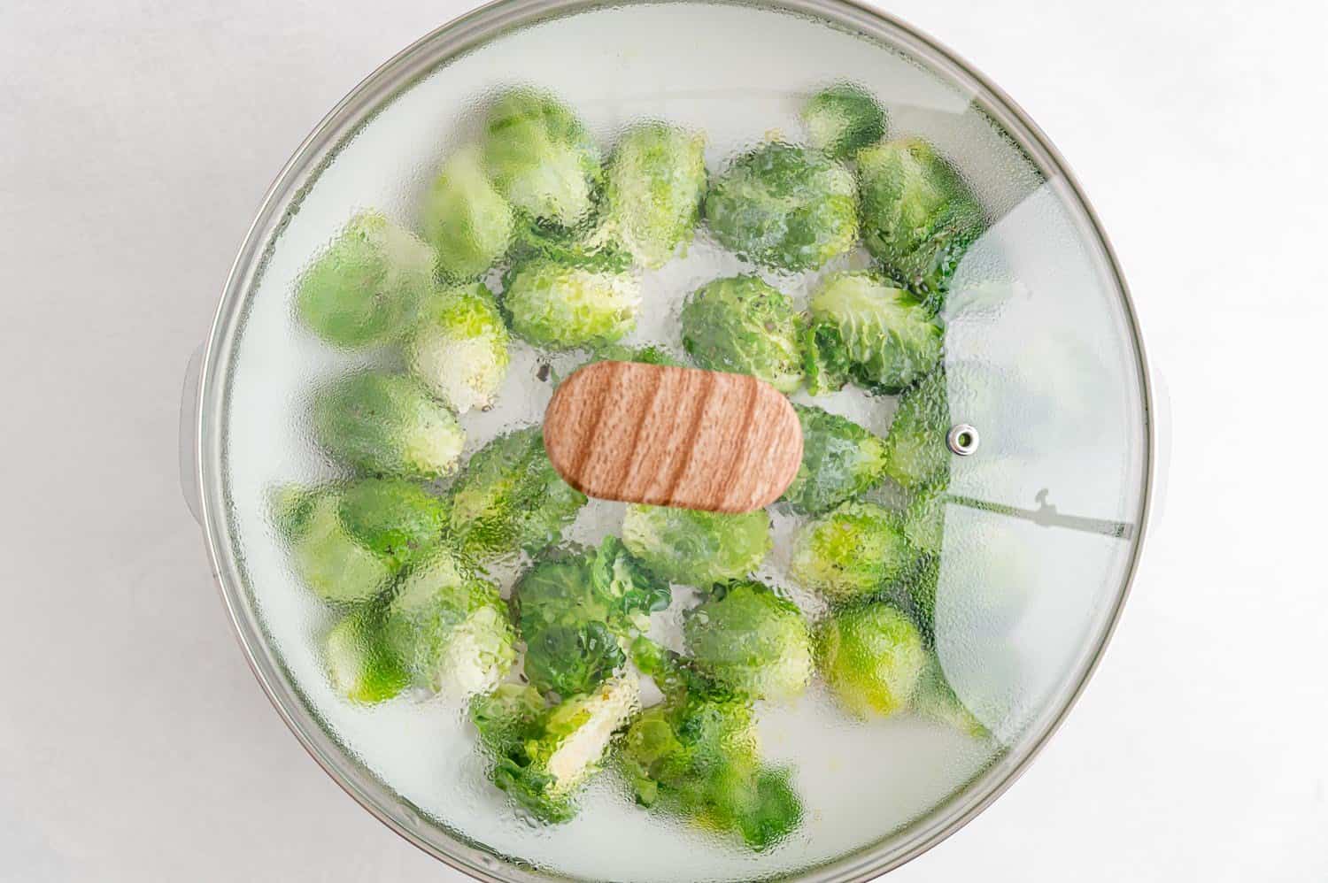 Covered pan of Brussels sprouts.