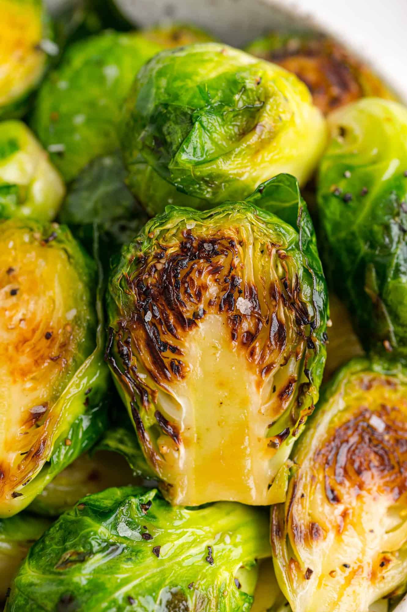 Close up of perfectly sautéed Brussels sprouts.