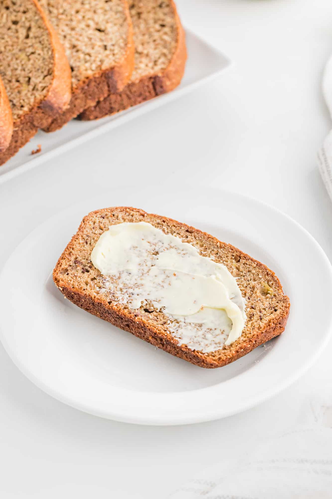 Slice of banana bread with butter.