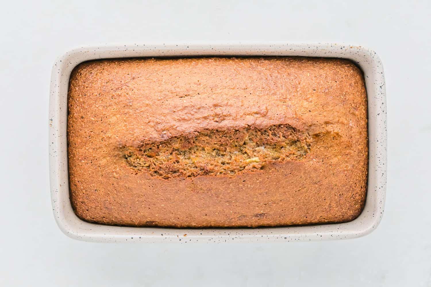 Baked banana bread in loaf pan.