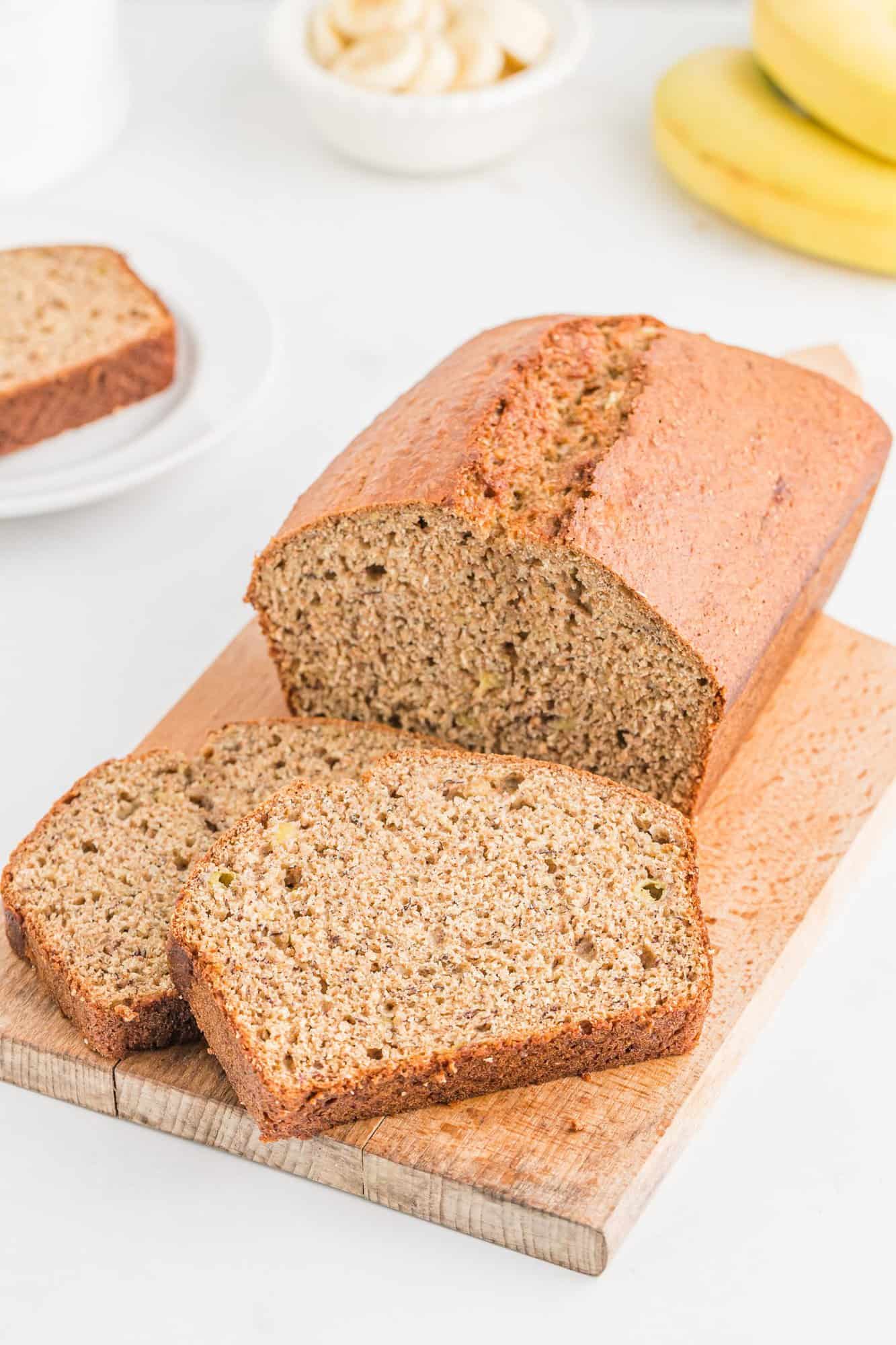 Whole Wheat banana bread, partially sliced.