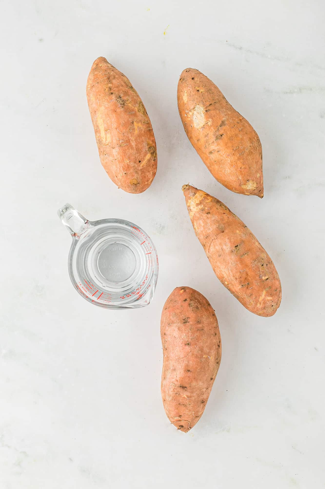 Uncooked sweet potatoes and water.