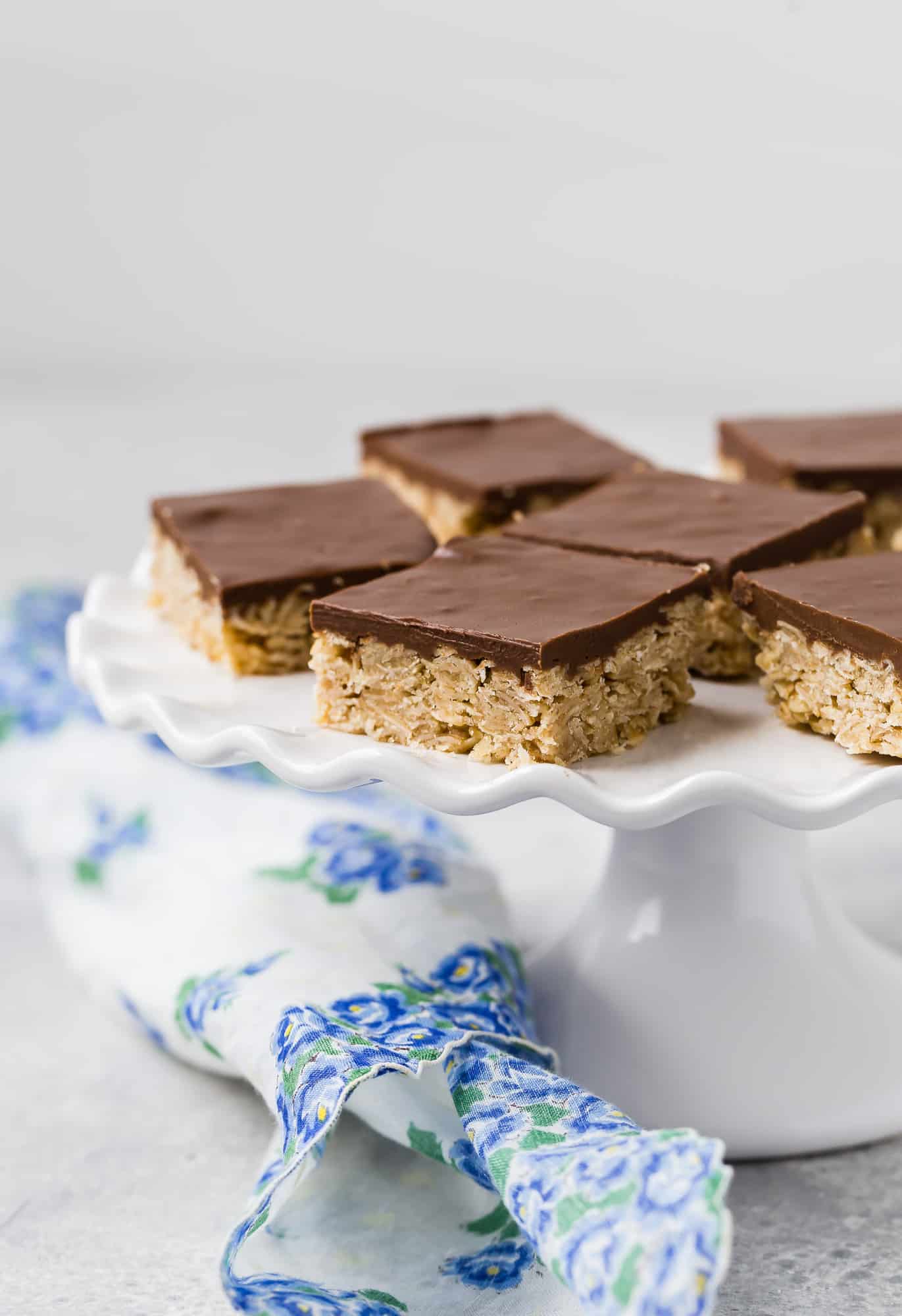 Oh Henry bars on a white cake stand.