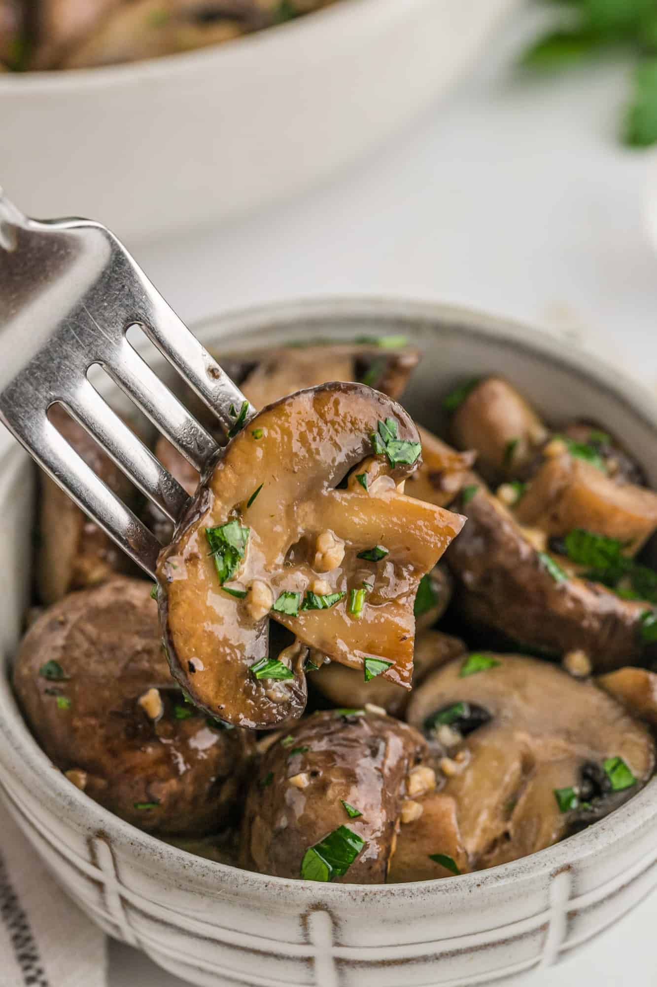 Sautéed mushroom on a fork.