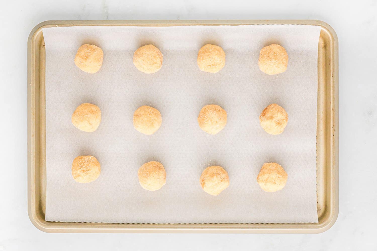 Unbaked cookies on a baking sheet.