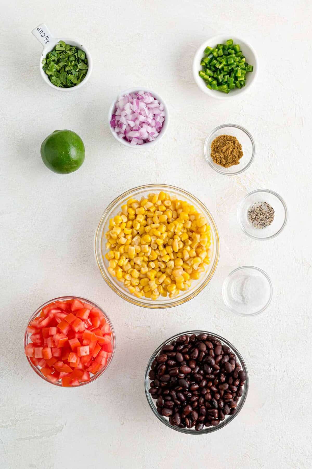 Ingredients needed, including black beans, corn, tomatoes, lime.
