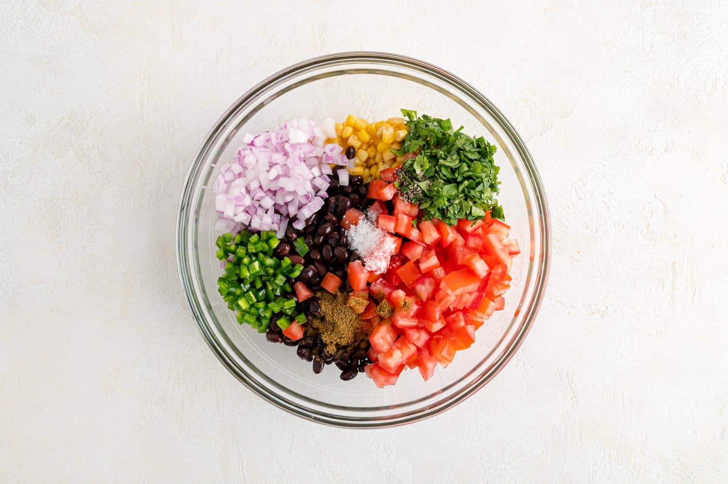 Salsa ingredients in a bowl, not yet mixed.