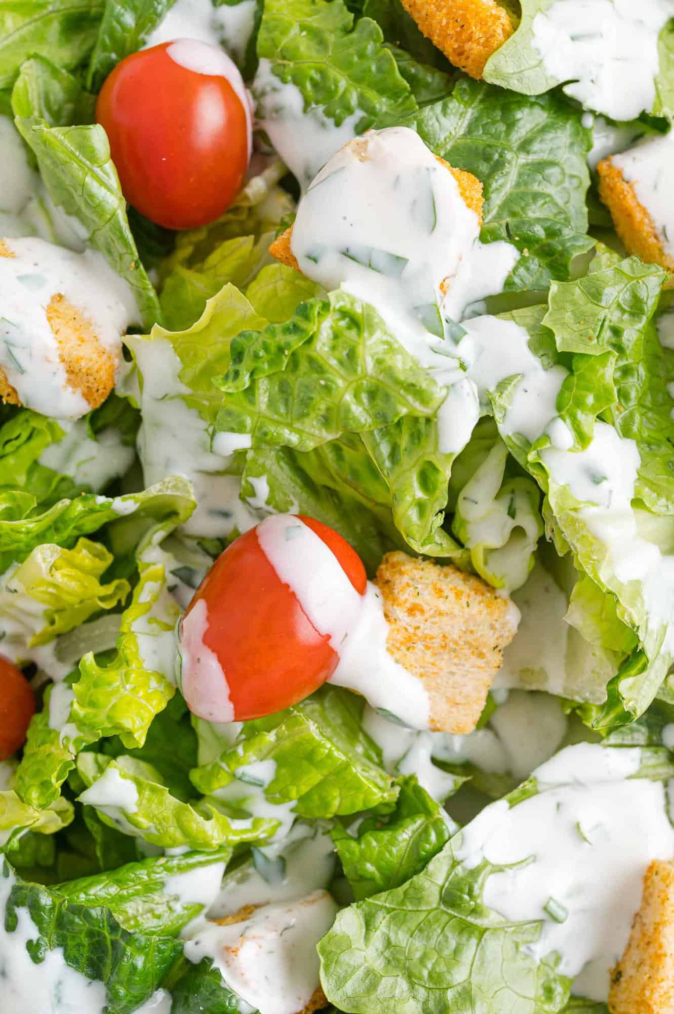 Ranch dressing drizzled on a traditional green tossed salad.