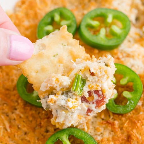 Jalapeño popper dip on a cracker.