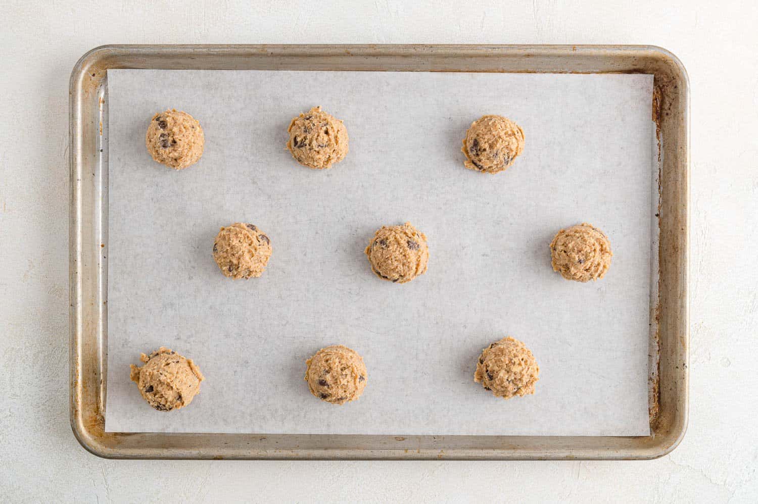 Unbaked cookies on baking sheet.