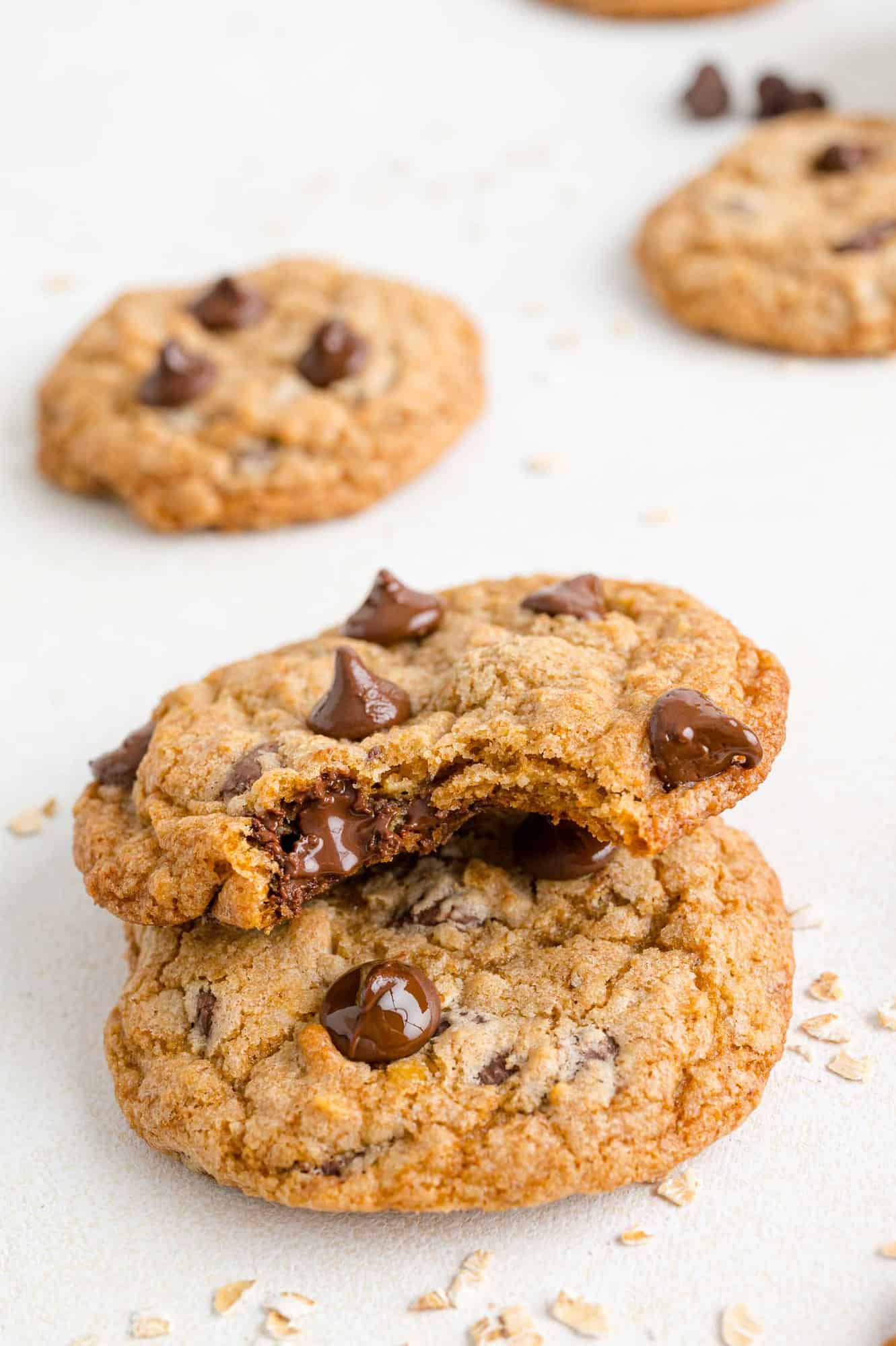 Two cookies stacked, one with a bite removed.