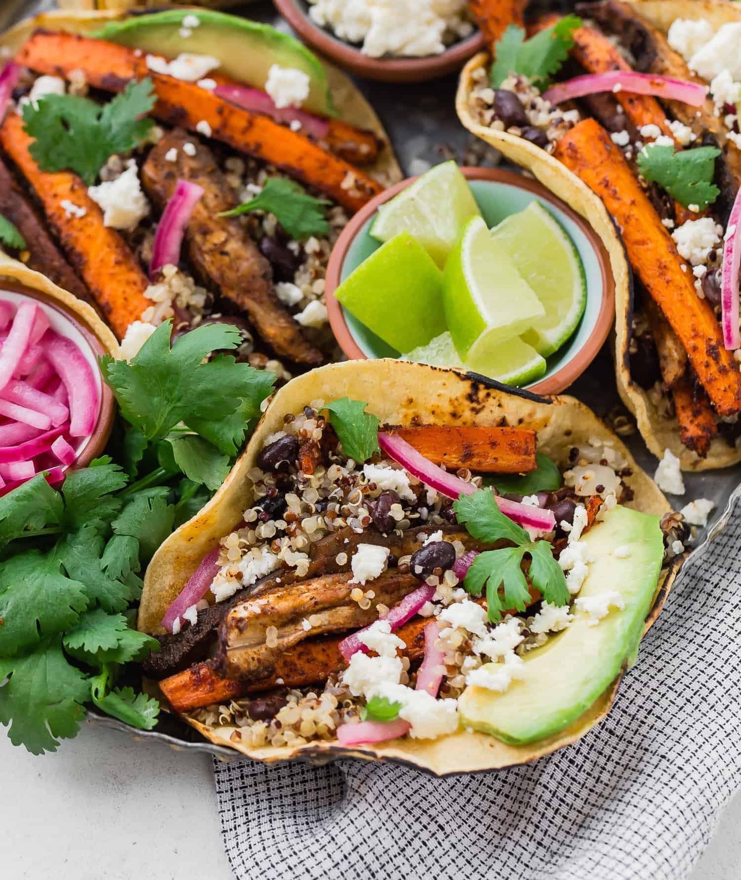 Close up of carrot, mushroom, quinoa, and black bean taco.