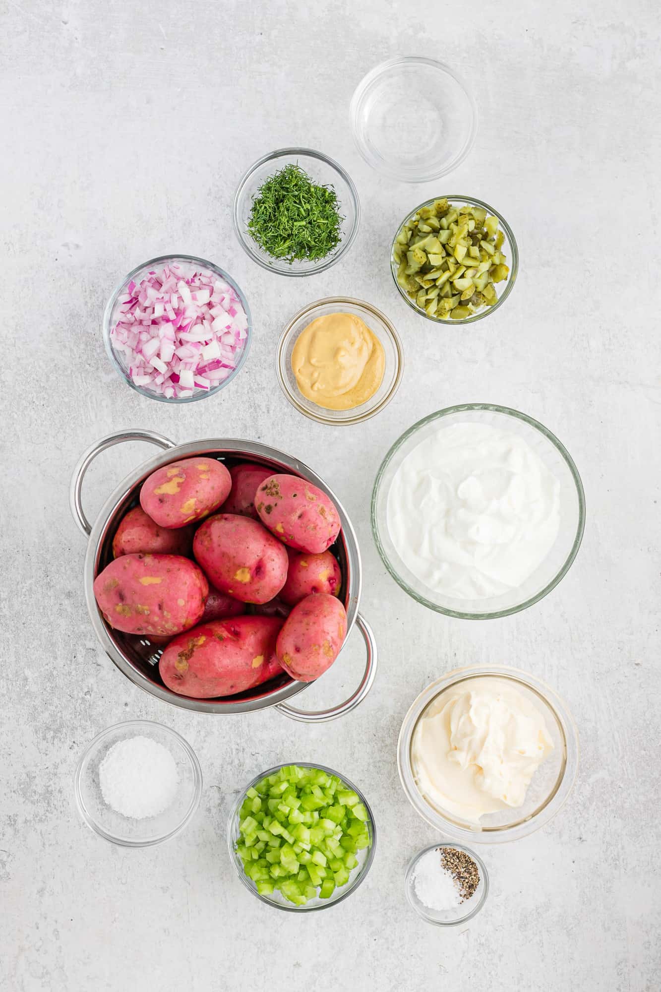 Ingredients needed for recipe including red potatoes and dill pickles.