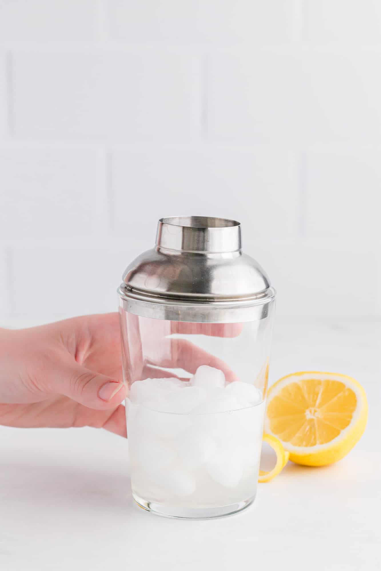 Cocktail shaker with ice and liquid.