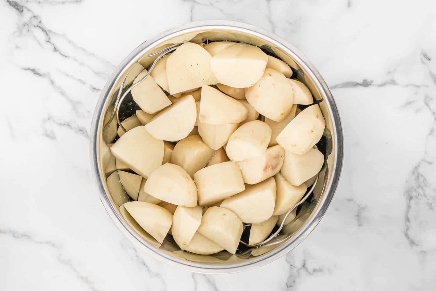 Uncooked potatoes in instant pot.
