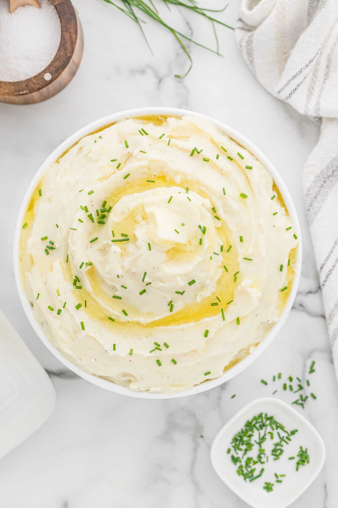 Overhead view of instant pot mashed potatoes in white bowl.