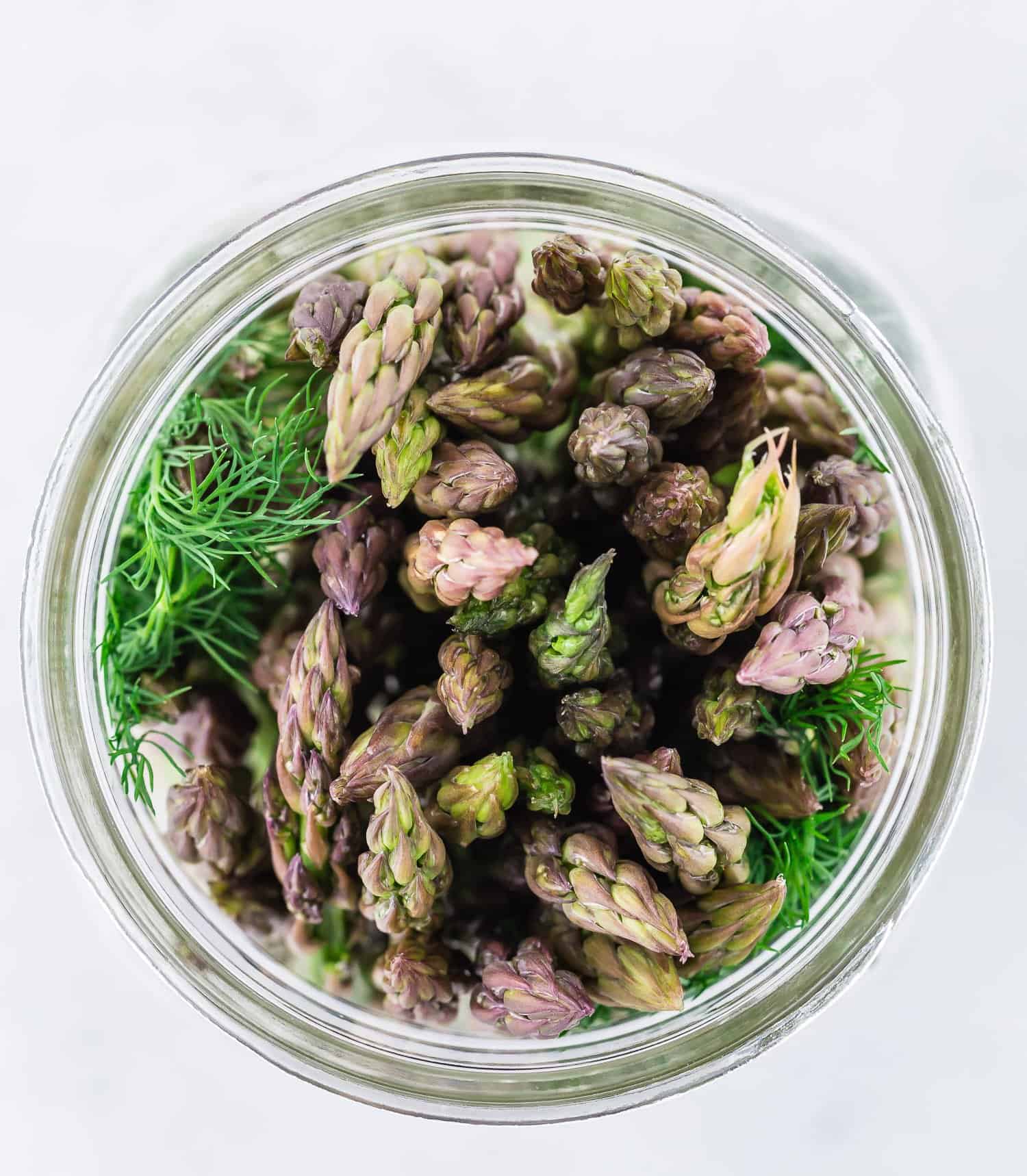 Overhead view of asparagus in a jar.