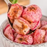 Roasted radishes on a serving spoon.