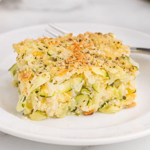 Slice of zucchini casserole with rice, cheese, panko topping.