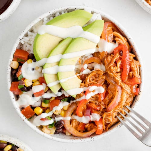 BBQ Chicken burrito bowl with avocado and sour cream.