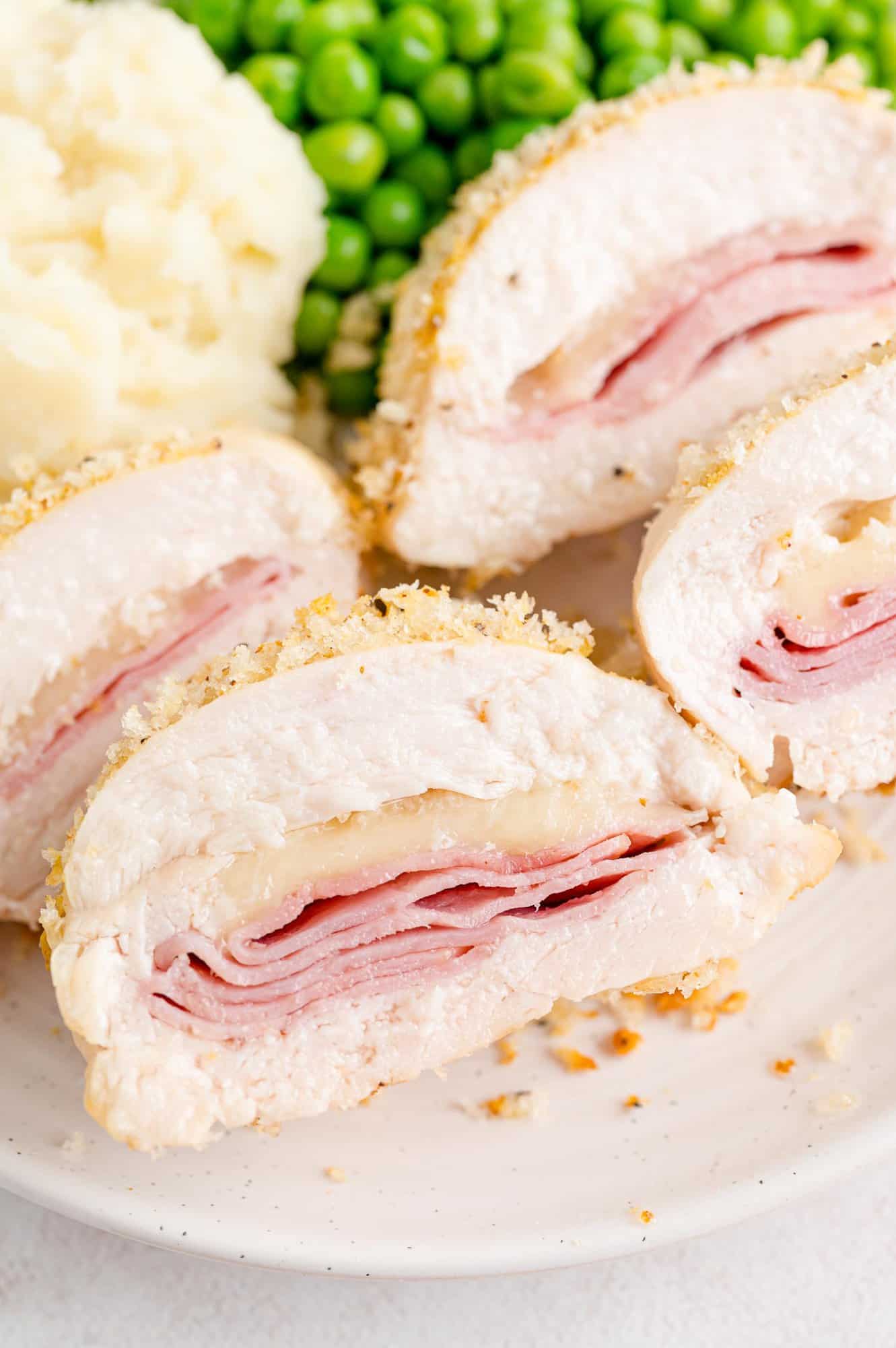 Chicken cordon bleu sliced and on a plate.