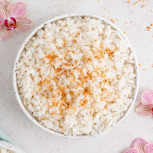 Coconut Rice sprinkled with toasted coconut flakes.