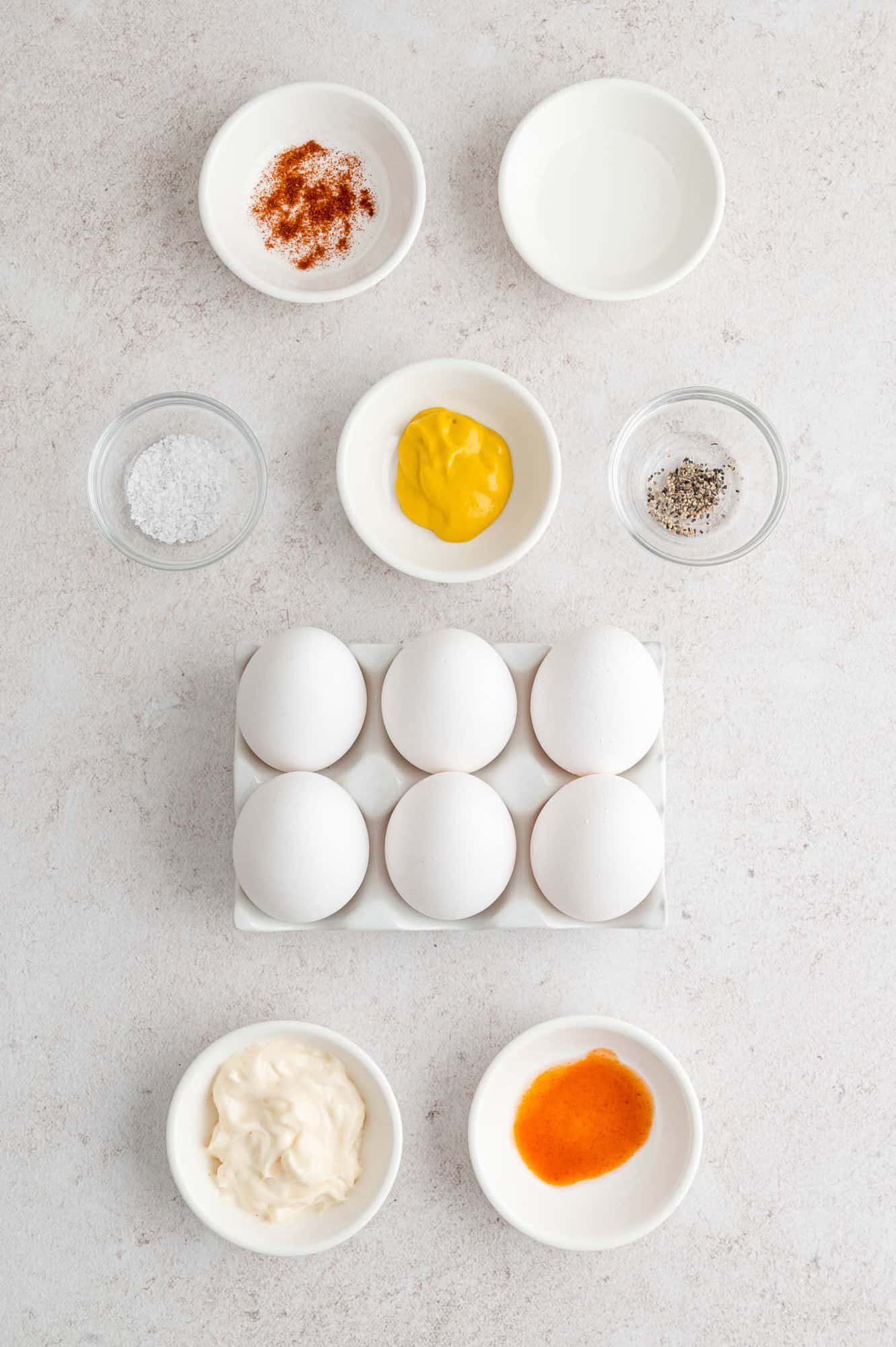 Ingredients needed for recipe including eggs, mustard, mayonnaise.