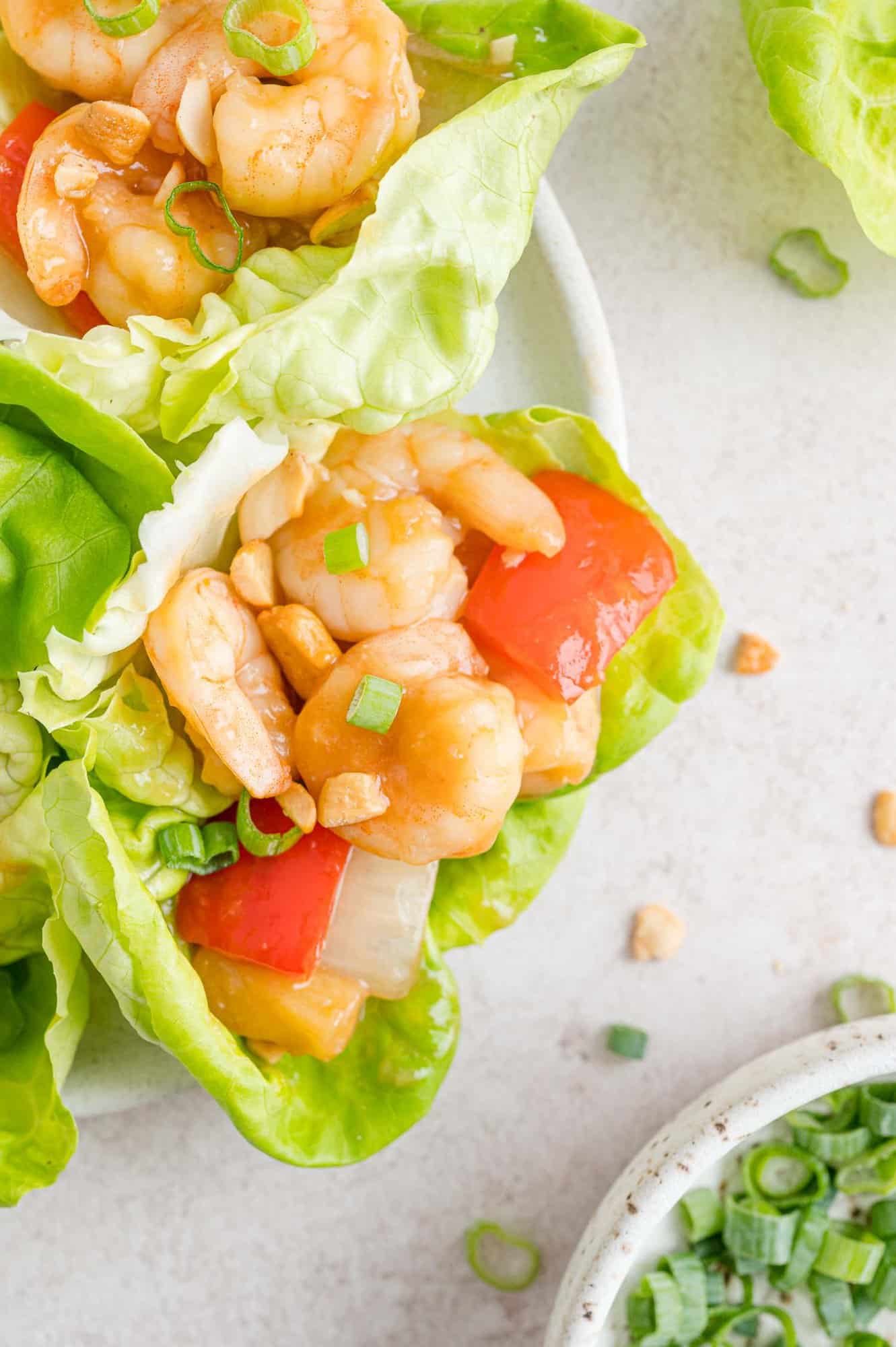 Sweet and sour shrimp lettuce wrap on a platter.