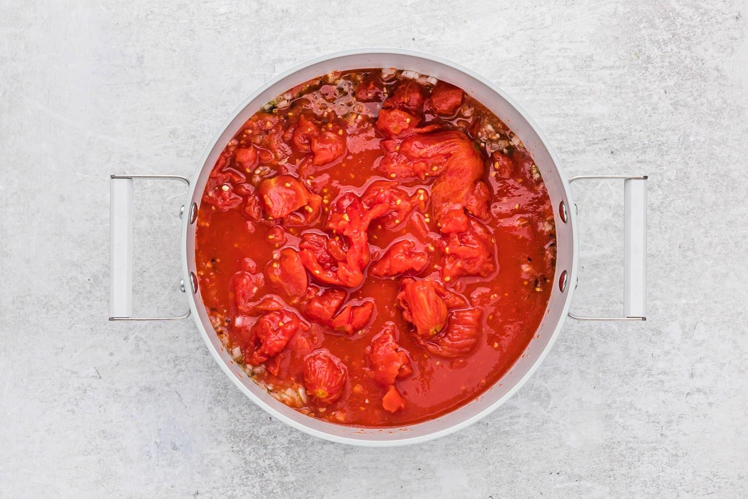 Tomatoes added to pan.