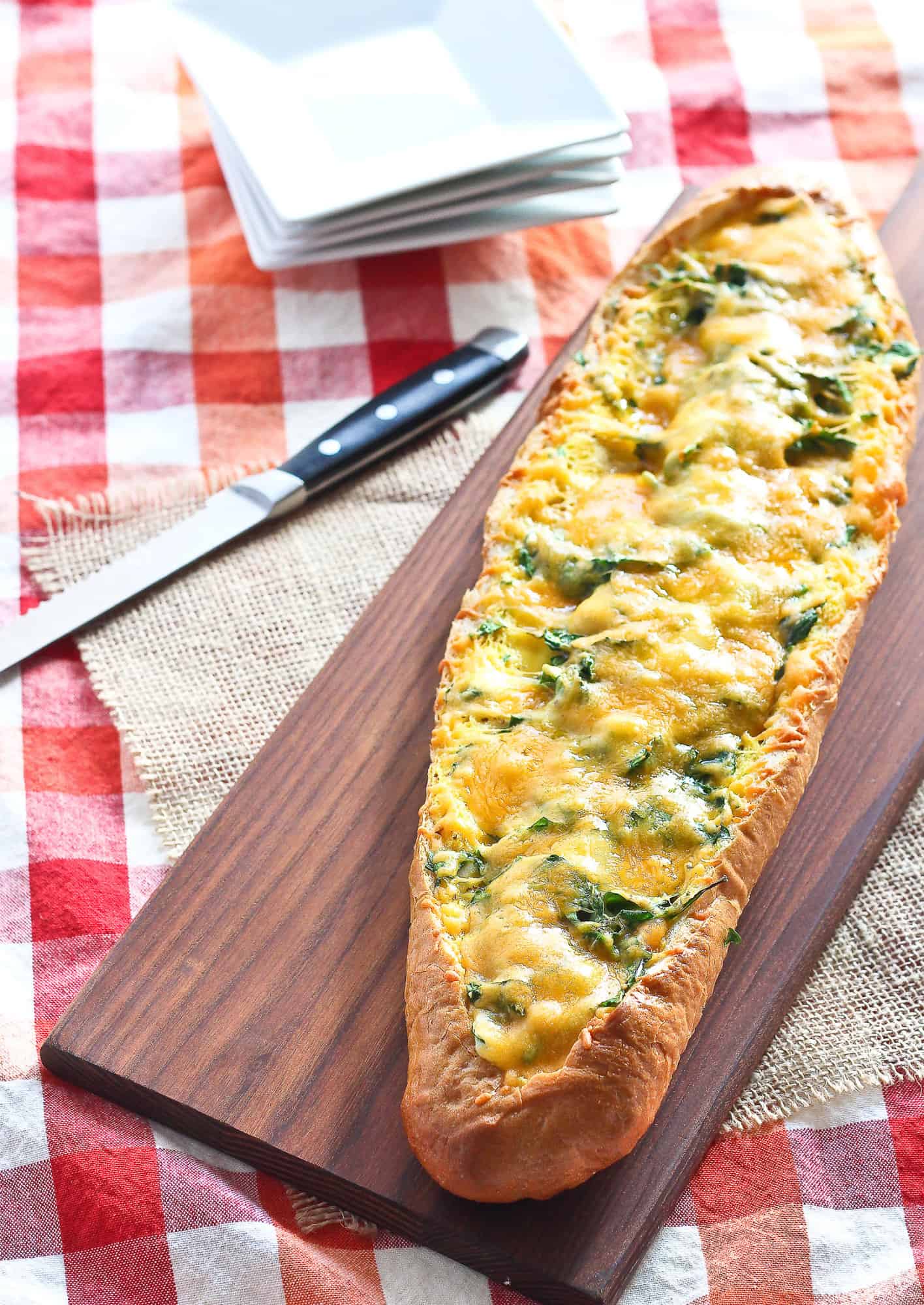 Egg boat with spinach, ham, and cheddar.