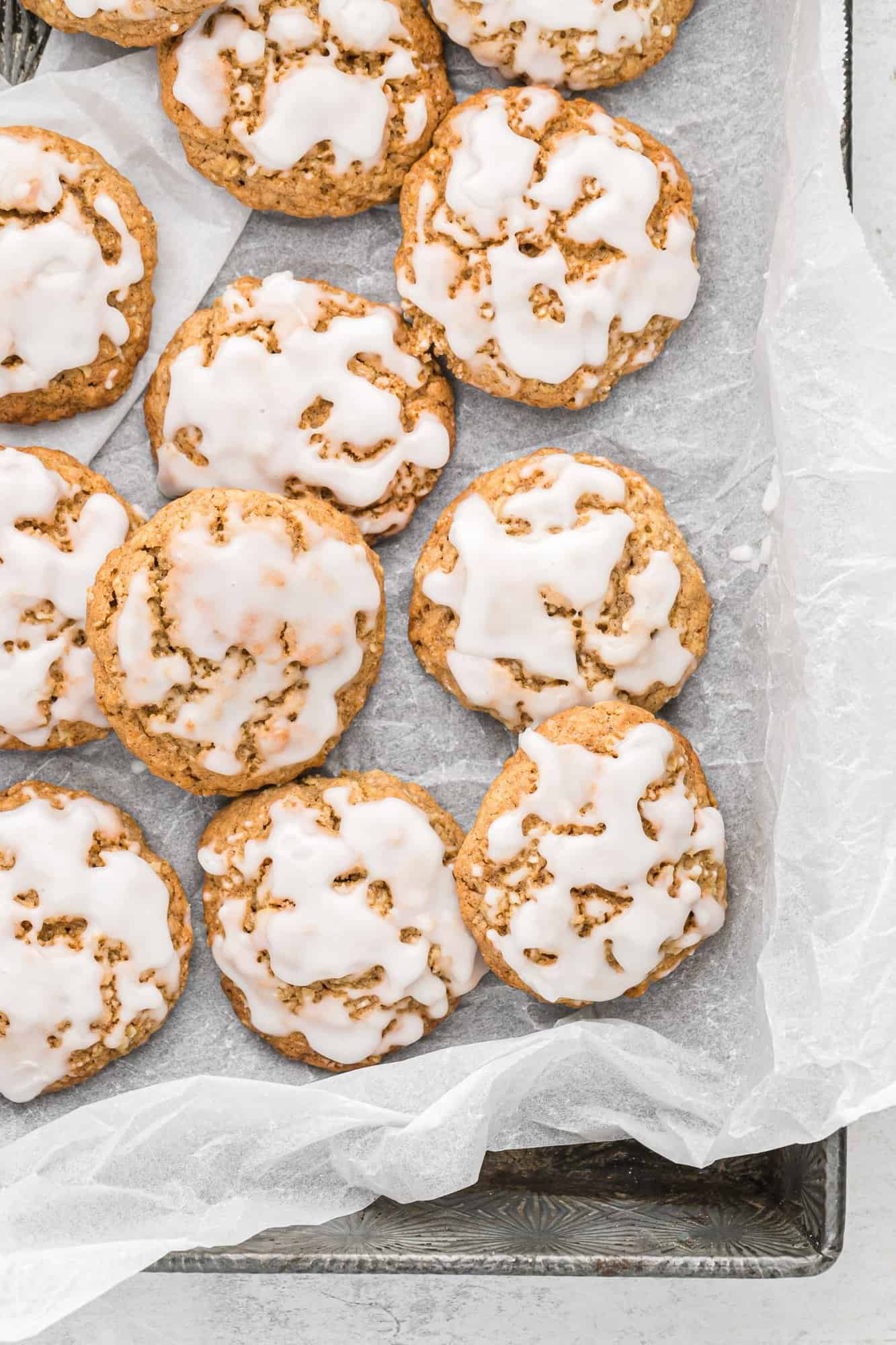 Iced oatmeal cookies in a pan.