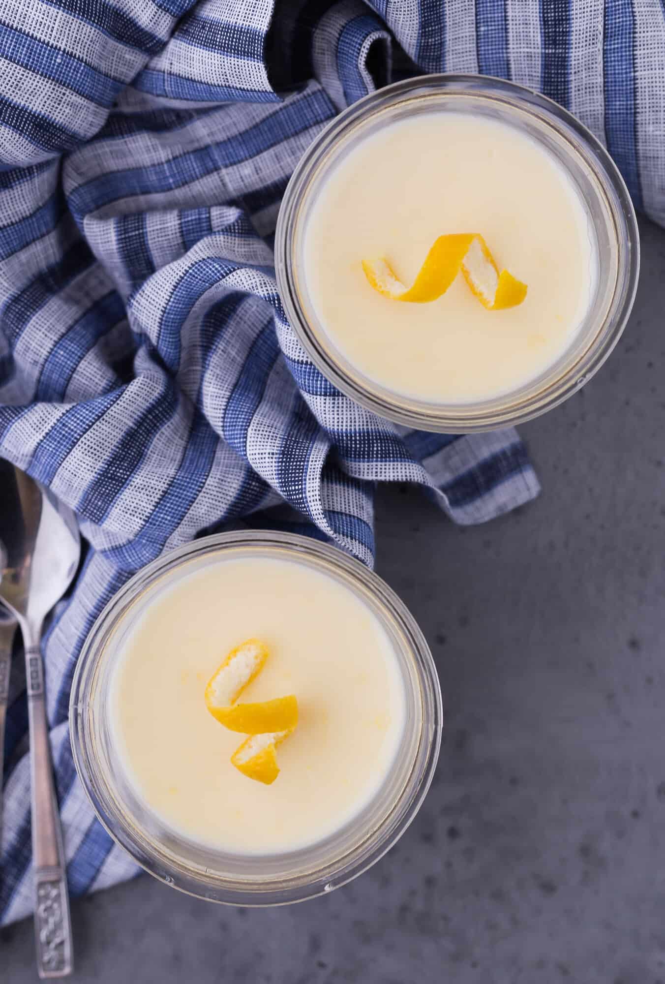 Overhead view of two servings of lemon pudding.