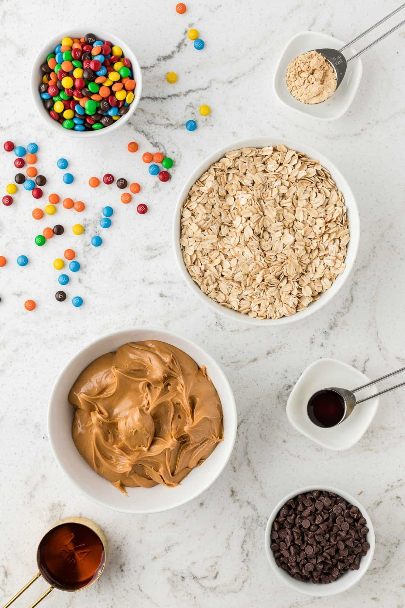 Overhead view of ingredients including peanut butter and oats.