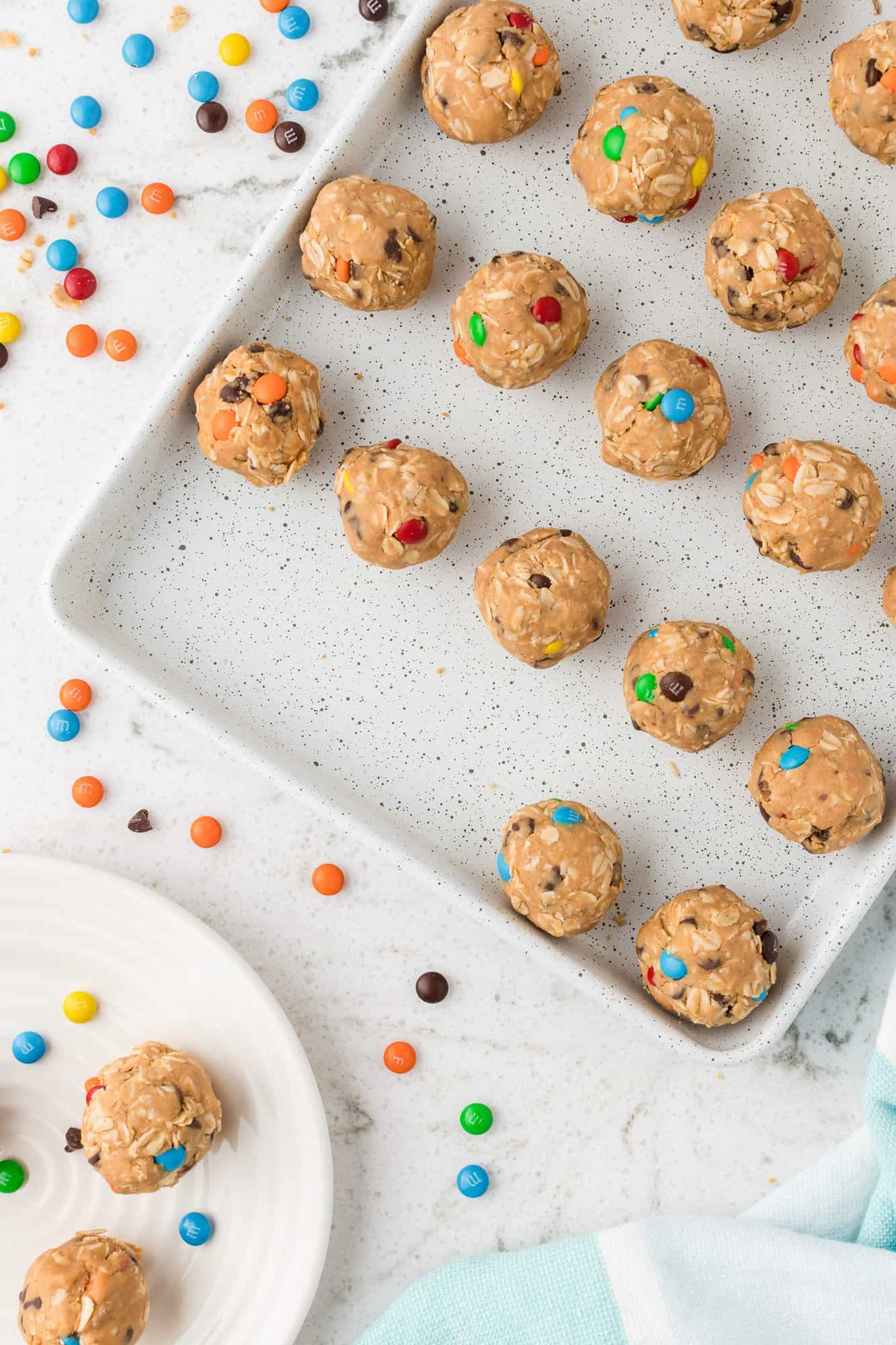 Rolled energy bites on a sheet pan.