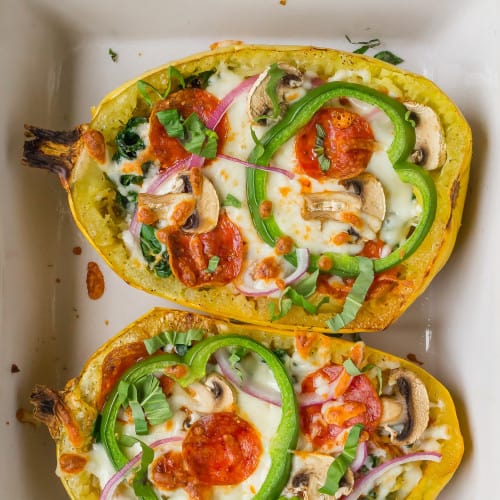 Pizza stuffed spaghetti squash with cheese, pepperoni, and vegetables.