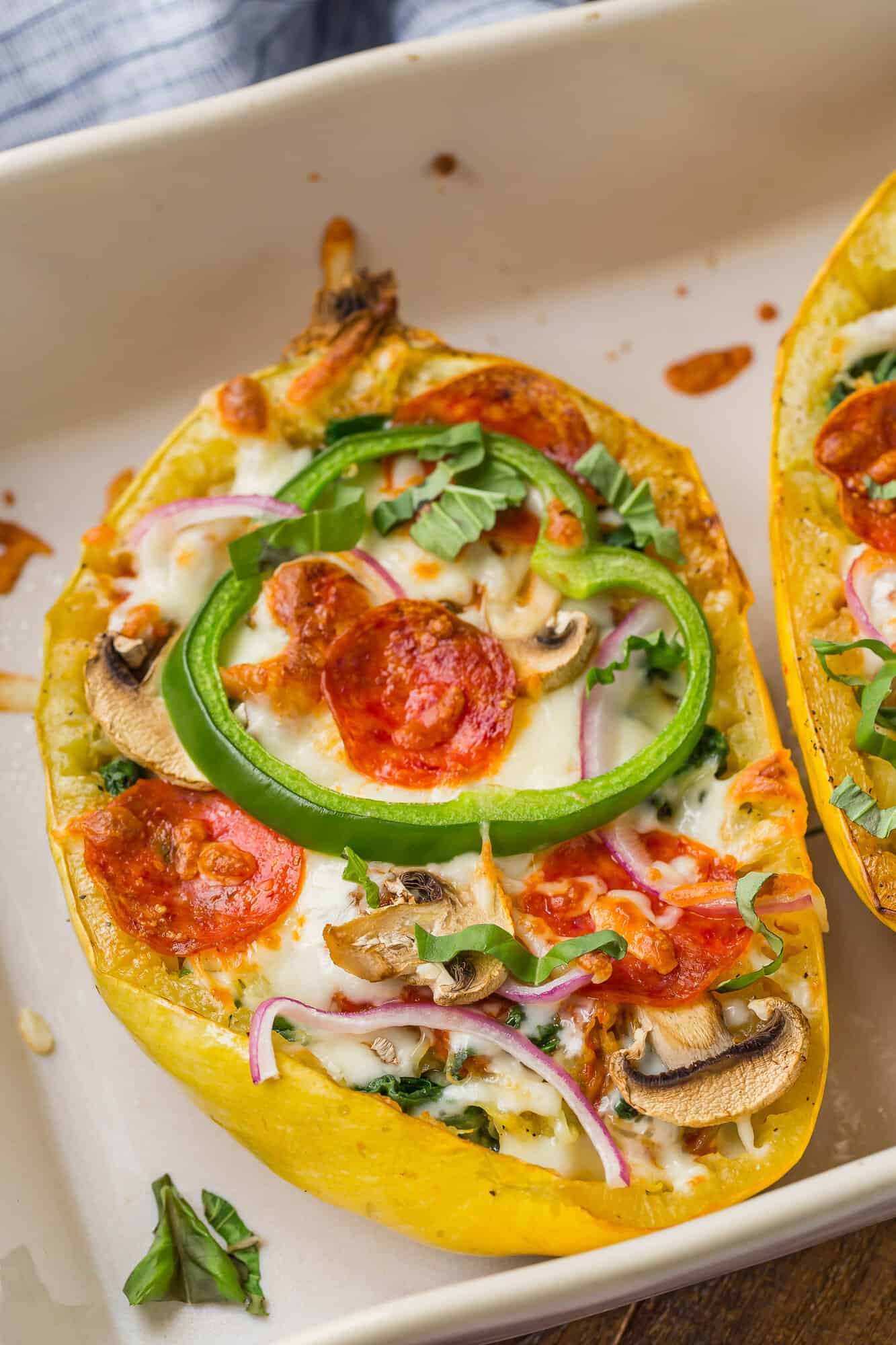 Stuffed spaghetti squash in a baking dish.