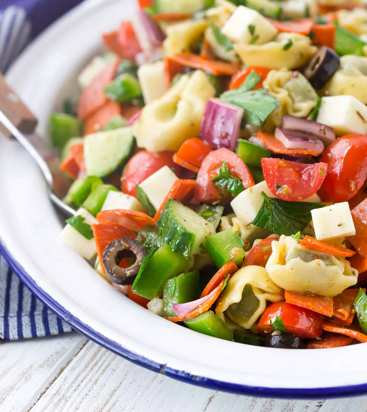 Pasta salad with tortellini, pepperoni, and more.