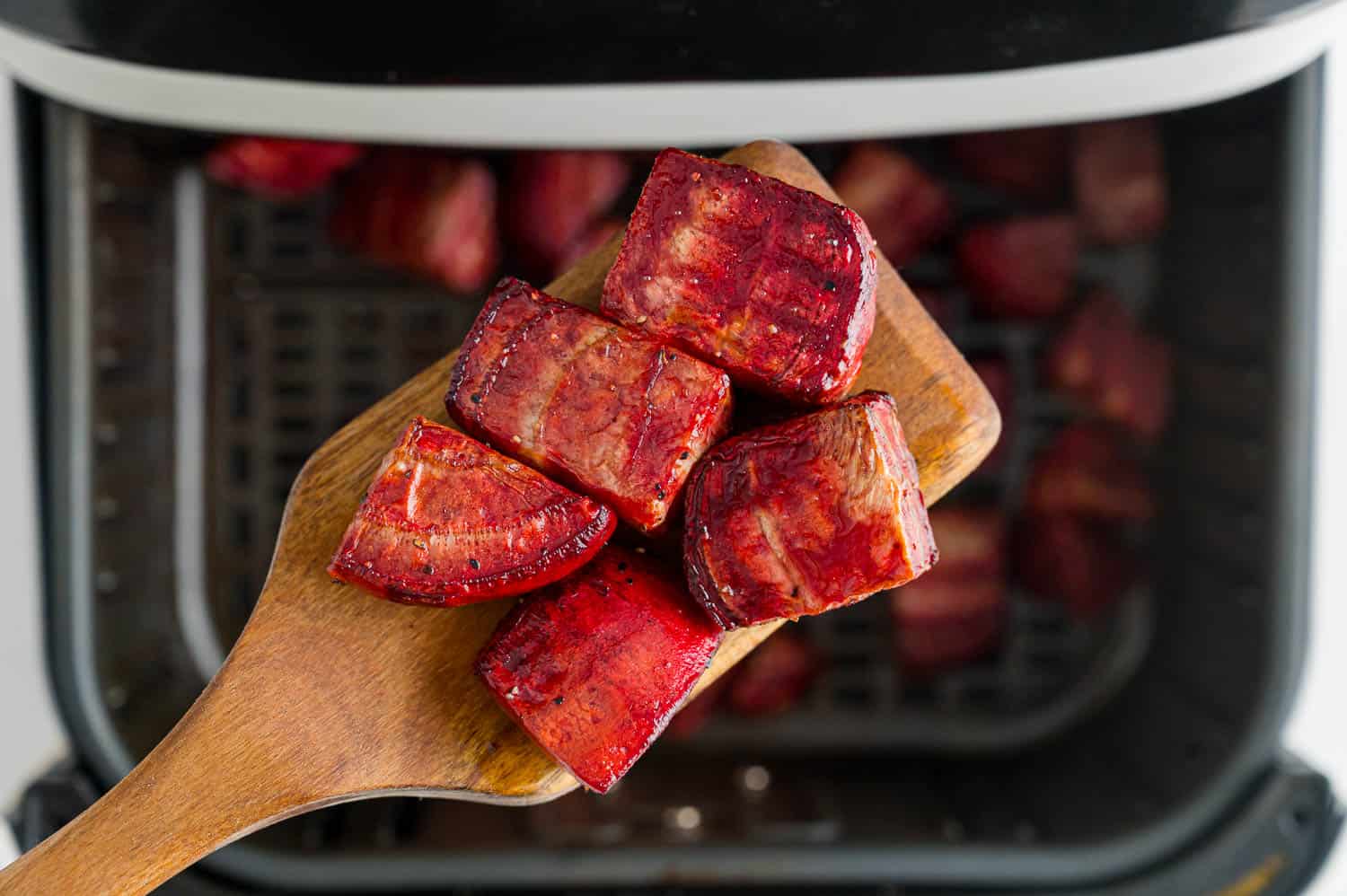 Cooked beets on a spatula.