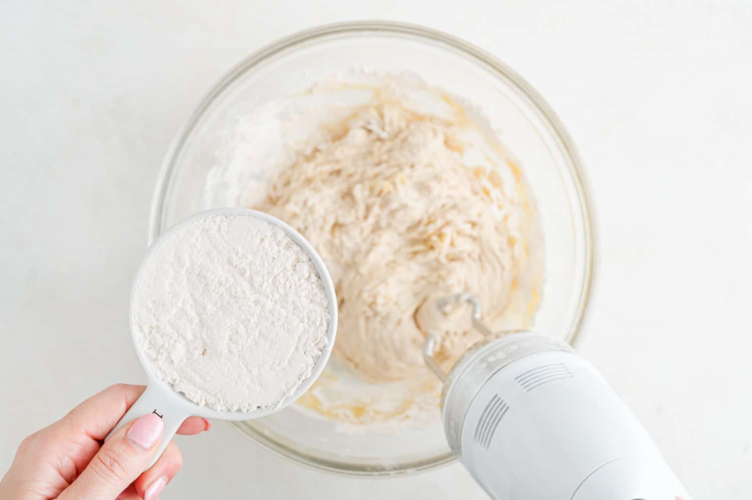 Flour being added to dough.