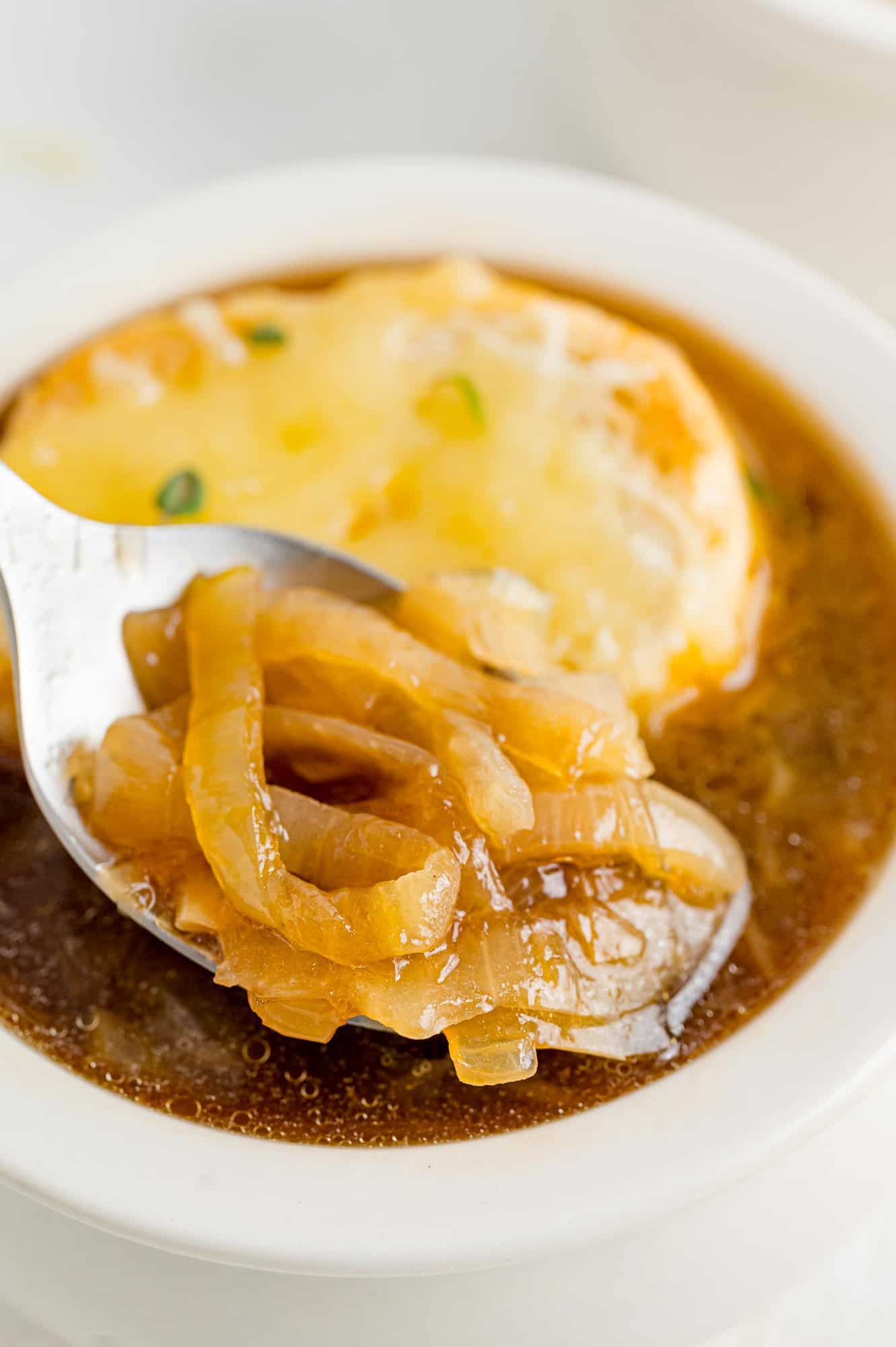 Onion soup on a spoon.