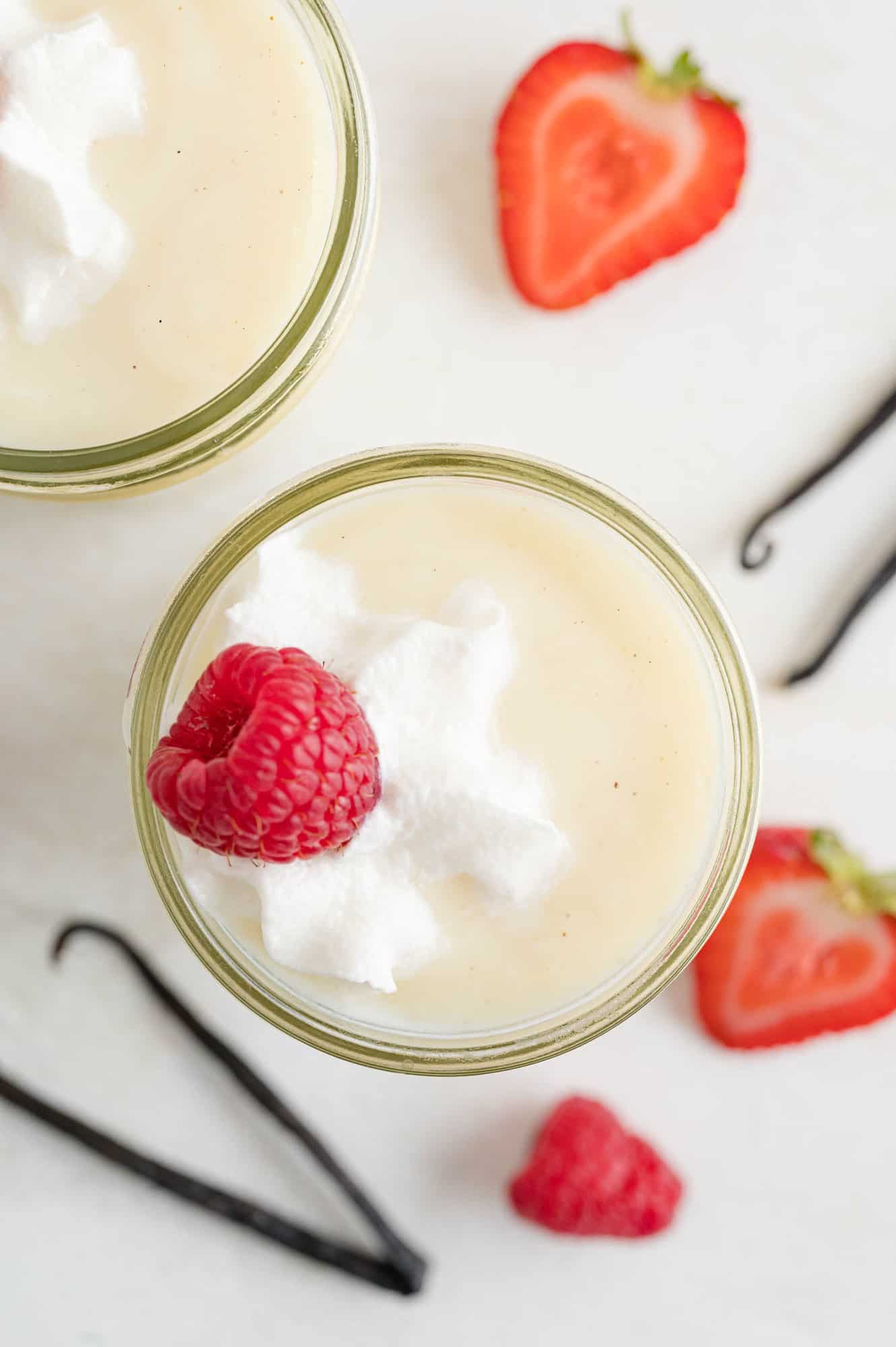 Overhead view of vanilla pudding in a jar.