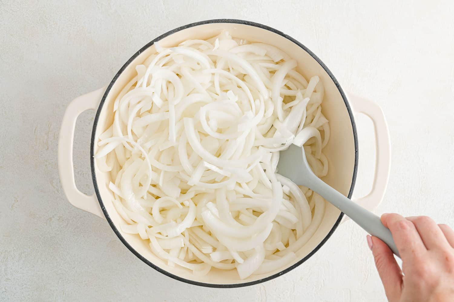 Uncooked onions in dutch oven.