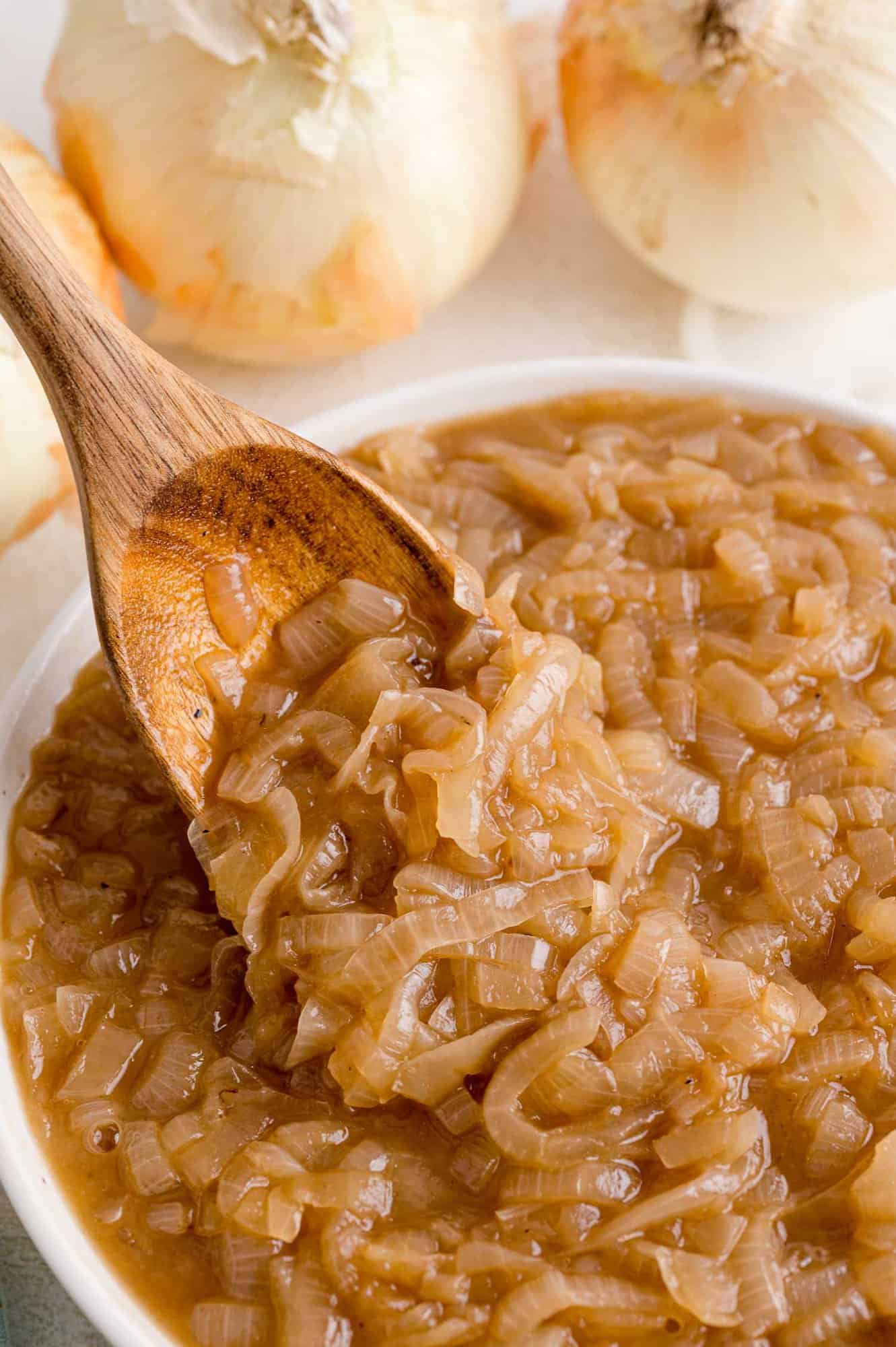 Caramelized onions in a bowl and on a spoon.